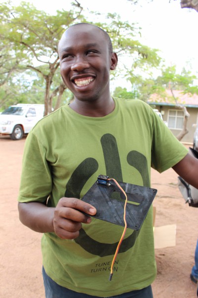 Arnold Bett, of University of Nairobi, displays a 3D printed housing for one of the drone's sensors. 