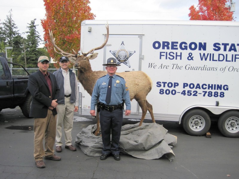 HSWLT's Jim Reed and Bob Koons donate a robotic elk decoy to the Oregon State Fish and Wildlife Department in 2009. Photo credit: HSWLT.