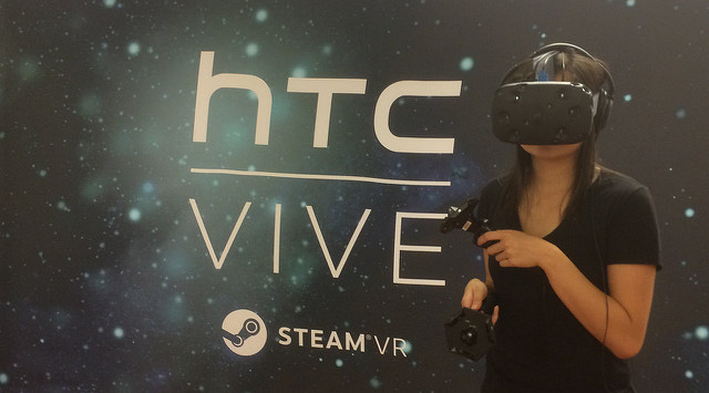 Girl testing the HTC Vive, which CNET claims is the best available VR experience because of the device's motion controls and room-scale tracking. Photo credit: 